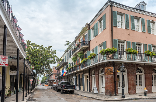 New Orleans, LA, USA - June 27, 2022: View of the traditional and historic architecture of the French Quarter in New Orleans. The French Quarter, also known as the Vieux Carré, is the oldest neighborhood in the city of New Orleans.