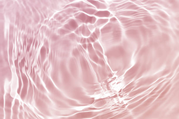 istock pink water wave, natural swirl pattern texture background, abstract summer photography 1407006192