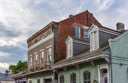 View of the traditional and historic architecture of the French Quarter in New Orleans. The French Quarter, also known as the Vieux Carré, is the oldest neighborhood in the city of New Orleans.