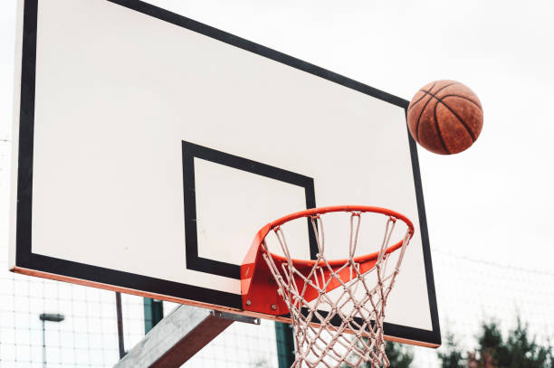 istock Basketball flying right into the hoop 1407007217