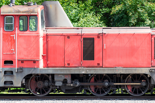 Close up side view of old diesel shunting locomotive with rod drive as concept for ancient technology on railroads