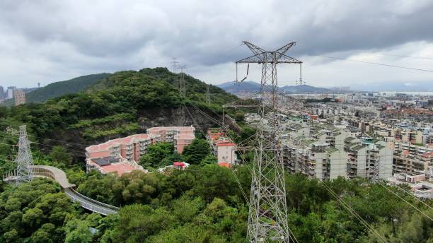 istock City power transmission tower, high voltage wires 1407014841