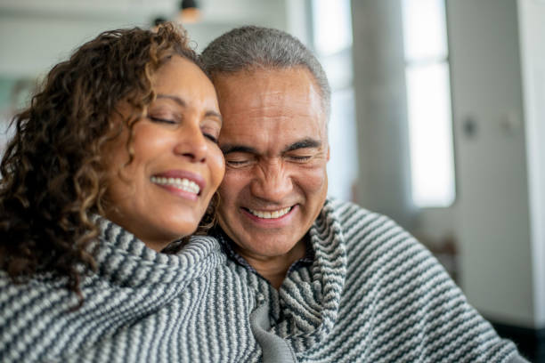 istock Senior Couple Cuddling 1407017077