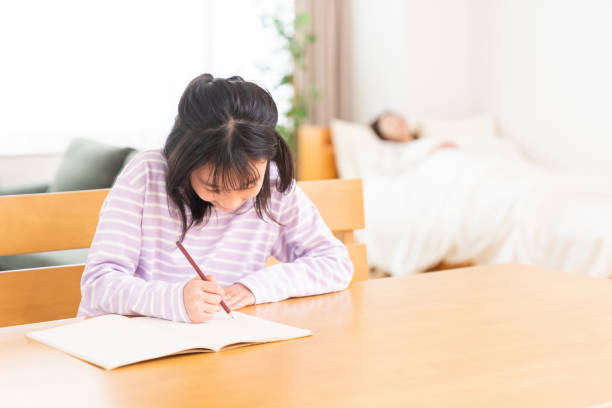 istock asian girl who study, sleeping mom 1407022417