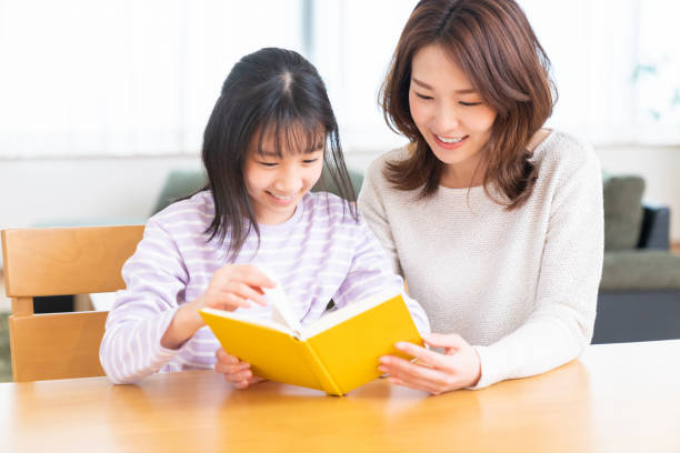 istock parent and daughter who reads a book 1407022433