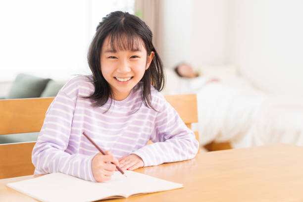 istock asian girl who study, sleeping mom 1407022477