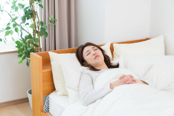 istock attractive asian woman who sleeps 1407022557