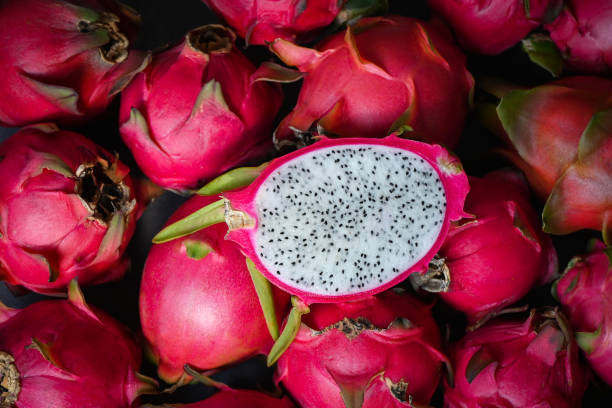 istock dragon fruit cut half on pitahaya background , fresh dragon fruit tropical in the asian thailand healthy fruit concept -top view 1407022711
