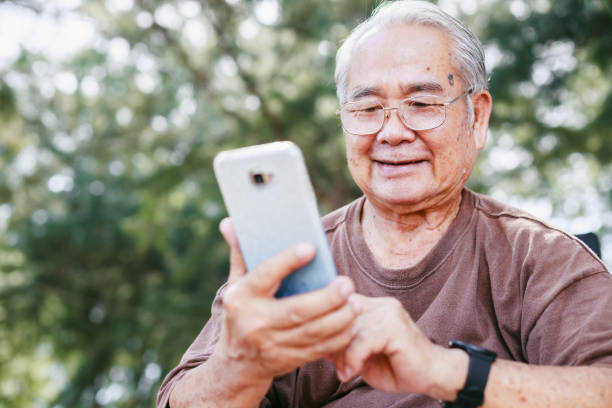 istock Elderly man with technology and leisure activity concept. Asian  retirement elderly using smartphone 1407022813