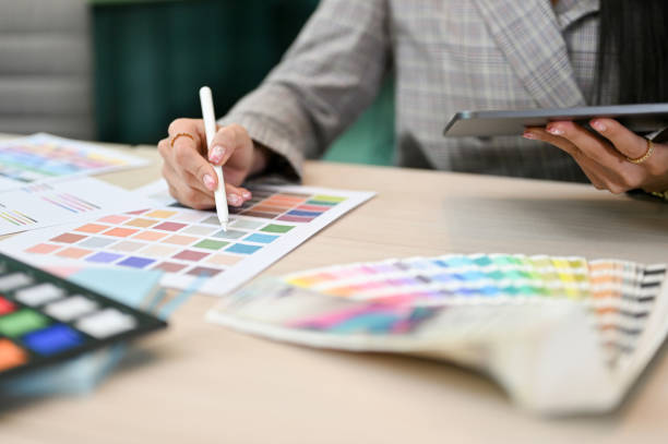 istock Cropped, Female graphic designer working at her office desk 1407024583