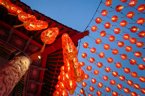 Kuala Lumpur, Malaysia - Feb 6th, 2022: Row of lighted red lanterns hanging at Thean Hou Temple, Kuala Lumpur Malaysia.