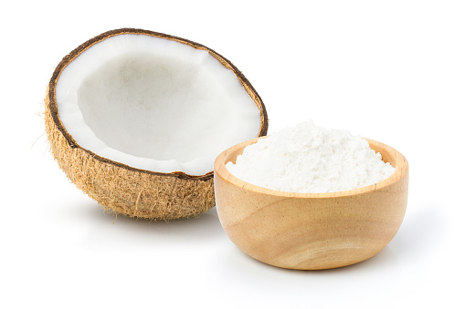 Coconut fruit and dry coconut powder isolated on white background.