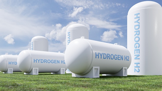 Hydrogen energy storage gas tank in meadow environment.