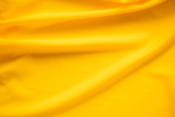 istock Yellow Color Fabric Background. 1407033746