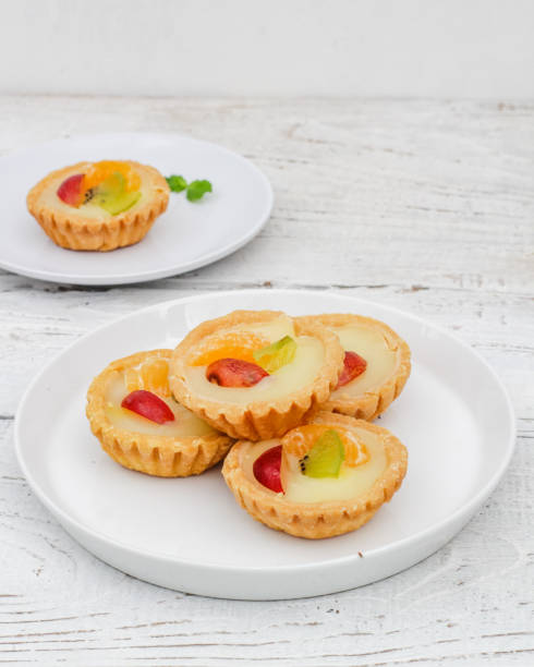 istock Small fruit pia cake on a textured white background. Kue Pia Buah. 1407035717