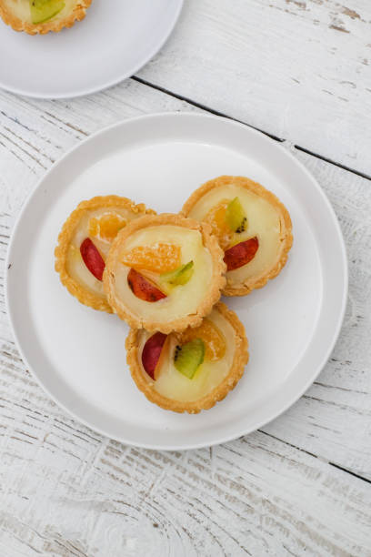 istock Small fruit pia cake on a textured white background. Kue Pia Buah. 1407035725