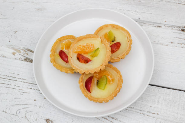 istock Small fruit pia cake on a textured white background. Kue Pia Buah. 1407035726