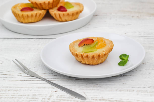 istock Small fruit pia cake on a textured white background. Kue Pia Buah. 1407035741