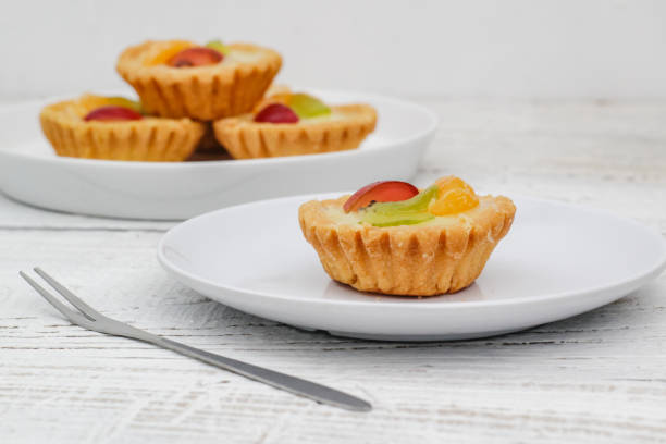 istock Small fruit pia cake on a textured white background. Kue Pia Buah. 1407035744