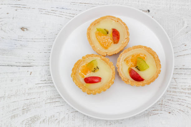 istock Small fruit pia cake on a textured white background. Kue Pia Buah. 1407035760
