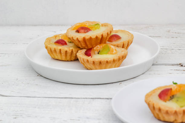 istock Small fruit pia cake on a textured white background. Kue Pia Buah. 1407035764