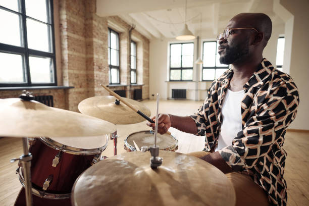 istock Drummer playing rock music on drums 1407038942