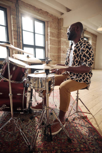 istock African drummer performing at drums set 1407039031