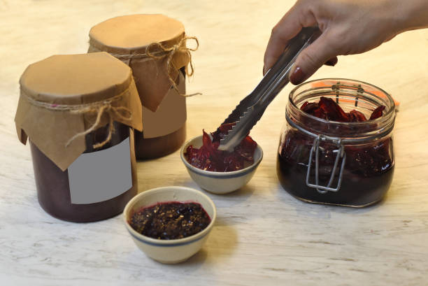 istock A hand serving homemade hibiscus jam in small bowls 1407045086