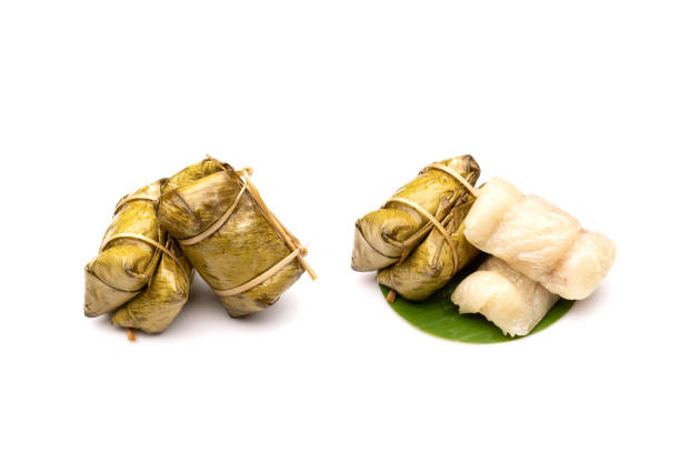 istock Bananas with Sticky Rice steamed in banana leaf (Khao Tom Mat) isolated on white 1407046038