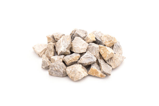istock Pile several size of stone for construction isolated on white 1407046793