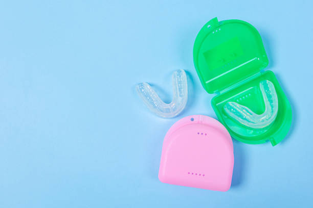 istock orthodontic silicone simulator. tray for teeth in a case Invisible leveling brackets. Mobile orthodontic appliance for teeth correction. The concept of  orthodontics 1407047472