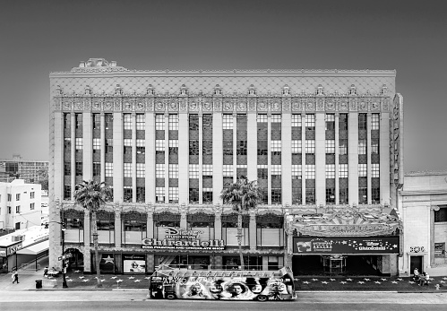 LOS ANGELES, USA - MAR 5, 2019: Hollywood and facade of famous cinema el Capitan and Chirardelli disney place by day.