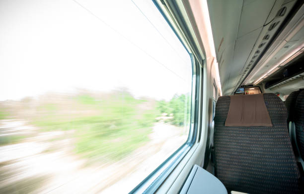 istock View of a Window scrolling the Landscape inside High Speed Train 1407047967