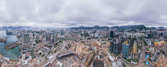 Epic panorama of huge construction site in the Kai Tak area, Kowloon, Hong Kong, daytime