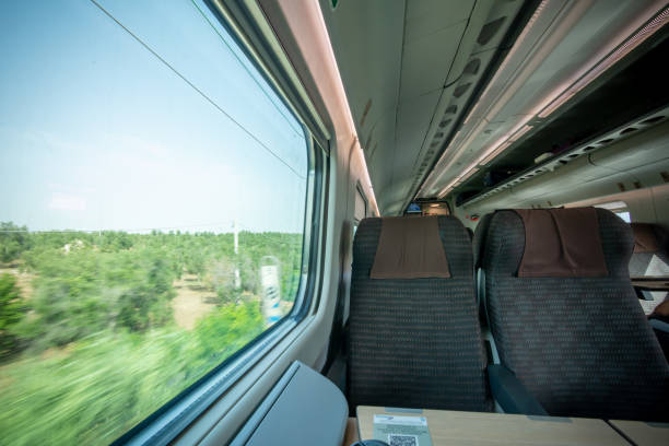 istock View of a Window scrolling the Landscape inside High Speed Train 1407047997
