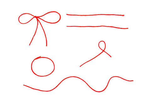 Formas abstractas por hilo rojo de lana, cuerda aislada sobre blanco, vista superior photo
