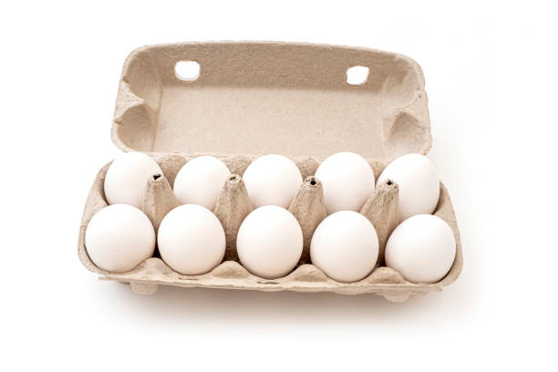 istock Top view of a ten chicken eggs in cardboard package isolated on white 1407049107