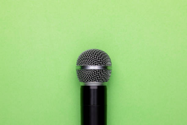 istock Black wireless microphone on color background. Copy space for text or design 1407052707