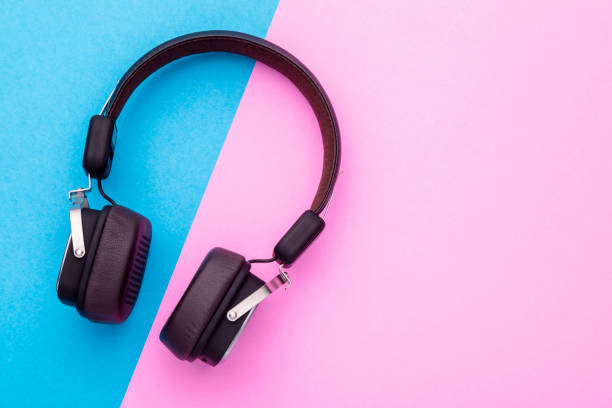 istock Black Headphone or Headset on bright color background. Copy space for text or design 1407055969