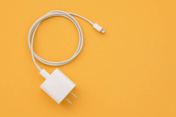 istock New white smartphone charger on orange background with copy space for text or design 1407056042