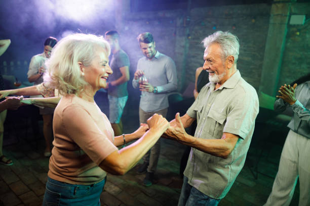 istock Happy mature couple dancing in a disco. 1407062912