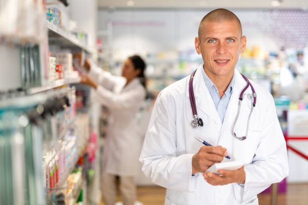 istock Pharmacist standing in drugstore 1407062914