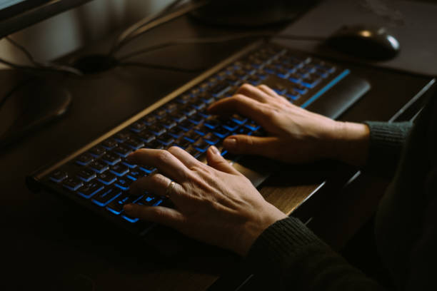 istock Woman freelancer Hands working on keyboard in evening 1407063889