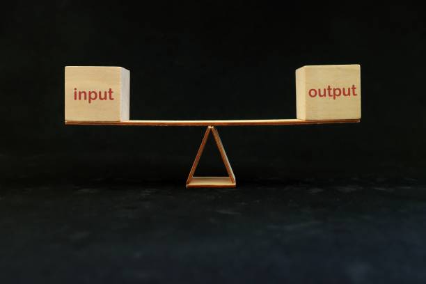istock Input equals output balance and process efficiency and productivity concept. Seesaw in dark black background. 1407064610