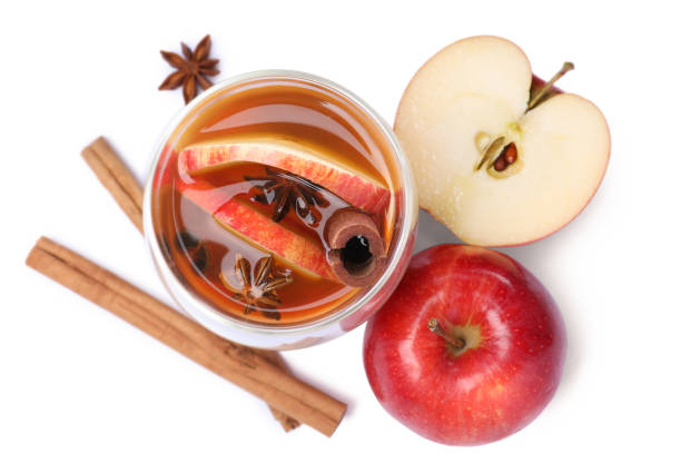 istock Hot mulled cider and ingredients on white background, top view 1407066883