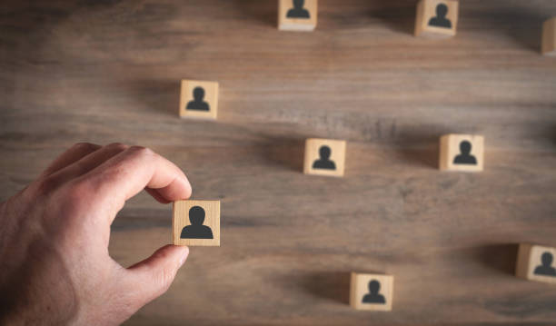 istock Human symbols on wooden cubes. Human resources. Management 1407067591