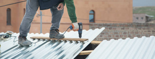 istock Man installing metal sheet roof by electrical drilling machine. 1407067604