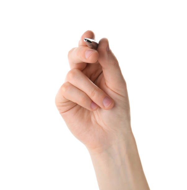istock Woman holding pen on white background, closeup 1407070104