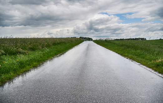 Small country road gray and cloudy day. Background image with copy space