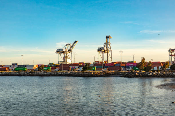 oakland harbor with container cranes in early morning light. Oakland serves as harbor for San Francisco stock photo